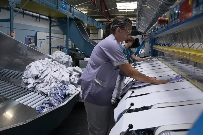 Calandre de séchage et de ré-enroulage en bobine