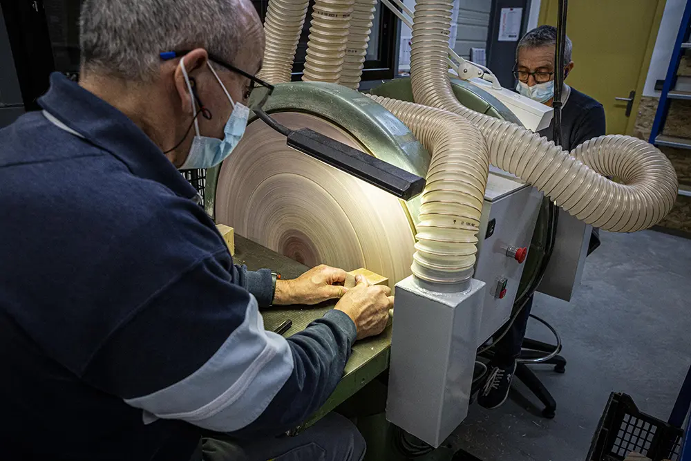 Machine d’usinage de bois, avec un système d’aspiration des poussières de bois